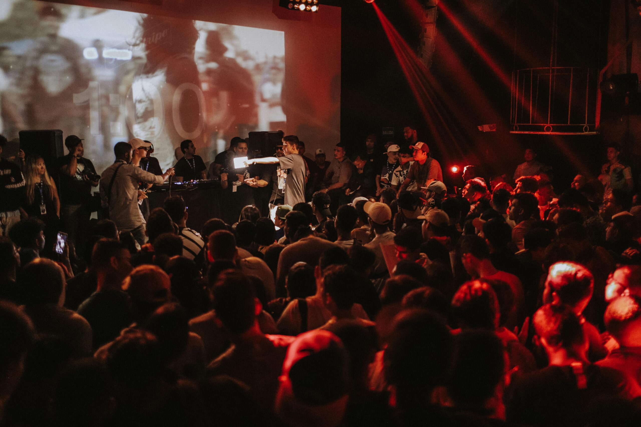 Energetic live concert scene with a vibrant crowd enjoying the music and lively atmosphere.